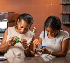 Helene Virolan and Avye Couloute Girls into Coding working on circuits