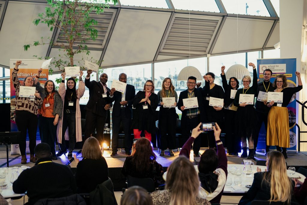 A cohort of the SSE Shifting London Programme show off their certificates of SSE fellowship at their graduation event at City Hall London January 2025